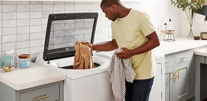 man-loading-a-washing-machine